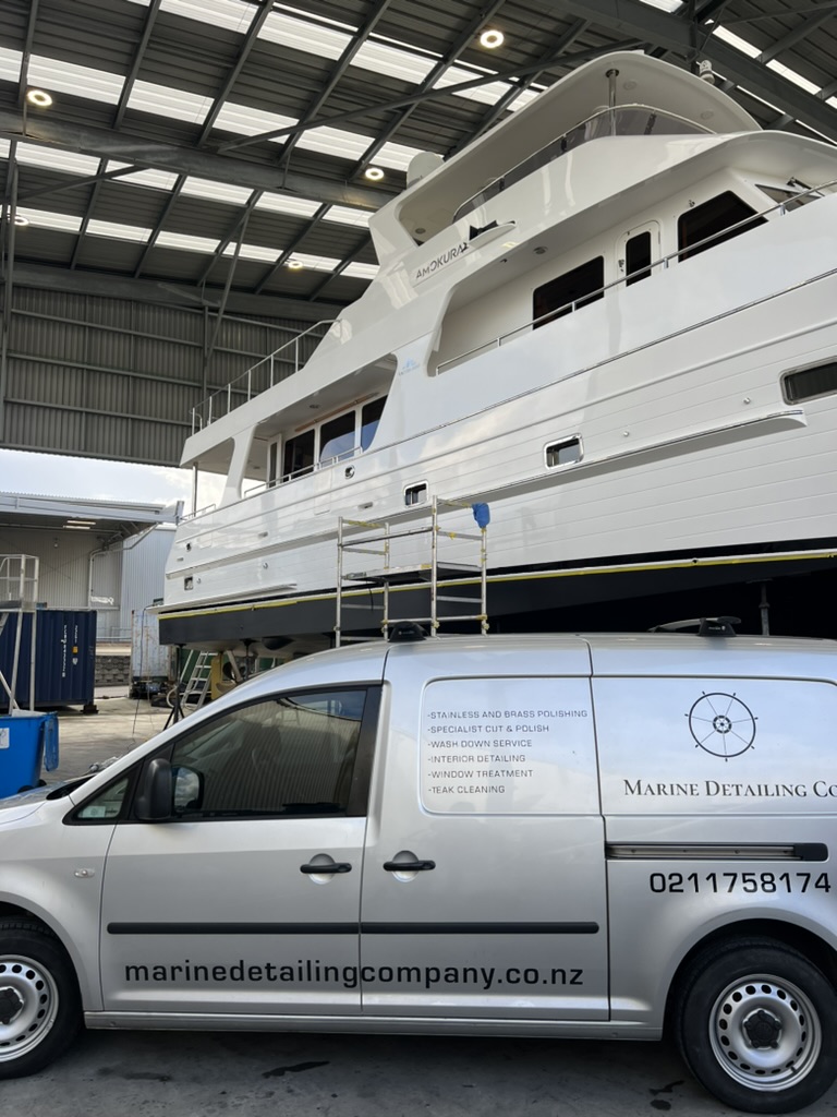 Marine Detailing Co. van beside a luxury yacht
